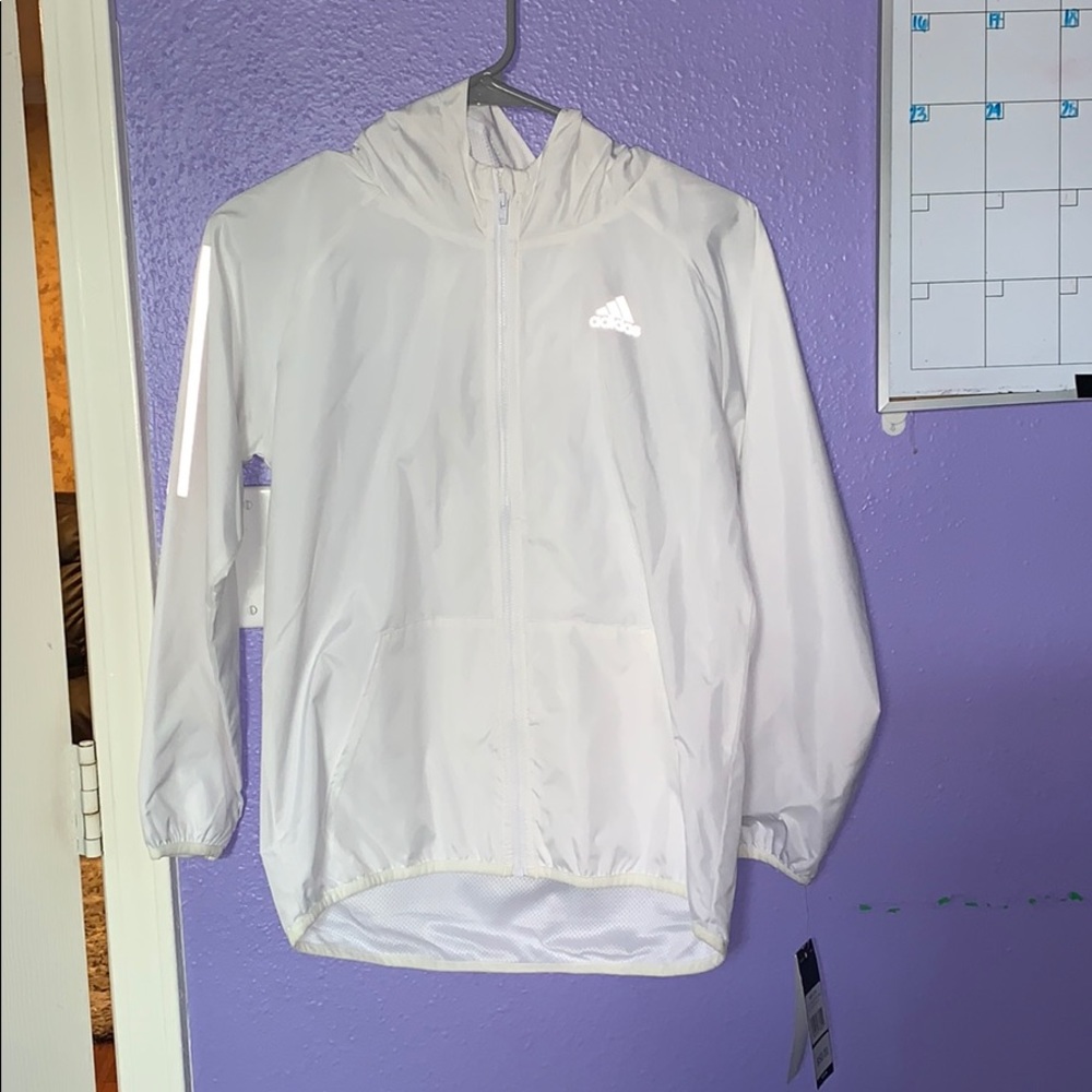 white reflective windbreaker